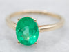 Modern Gold Emerald Solitaire Engagement Ring