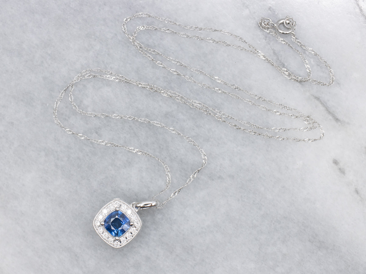 Cushion-Cut Sapphire and Diamond Halo Pendant. Necklace