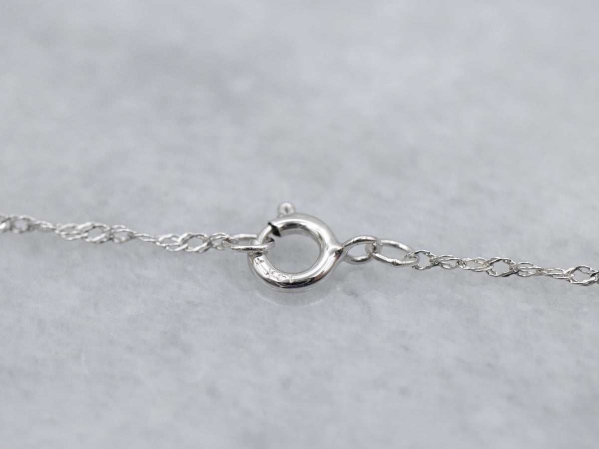 Cushion-Cut Sapphire and Diamond Halo Pendant. Necklace