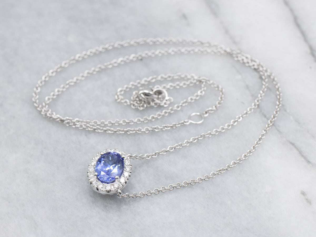 Modern East-to-West Set Tanzanite and Diamond Halo Pendant Necklace