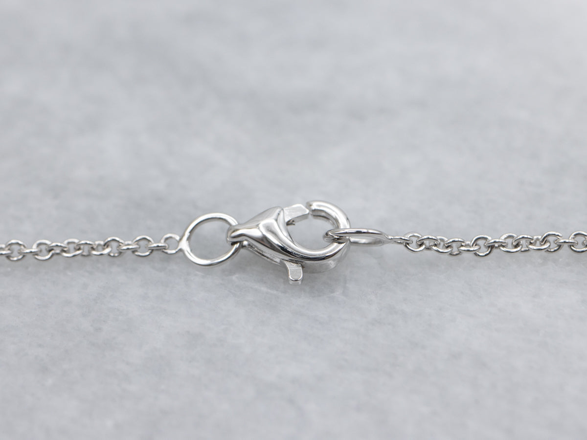 Modern East-to-West Set Tanzanite and Diamond Halo Pendant Necklace