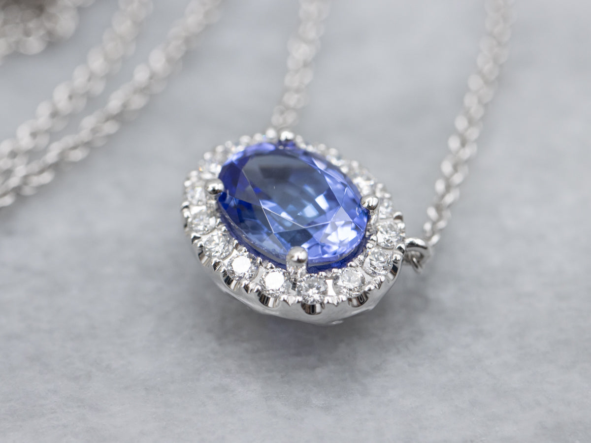 Modern East-to-West Set Tanzanite and Diamond Halo Pendant Necklace