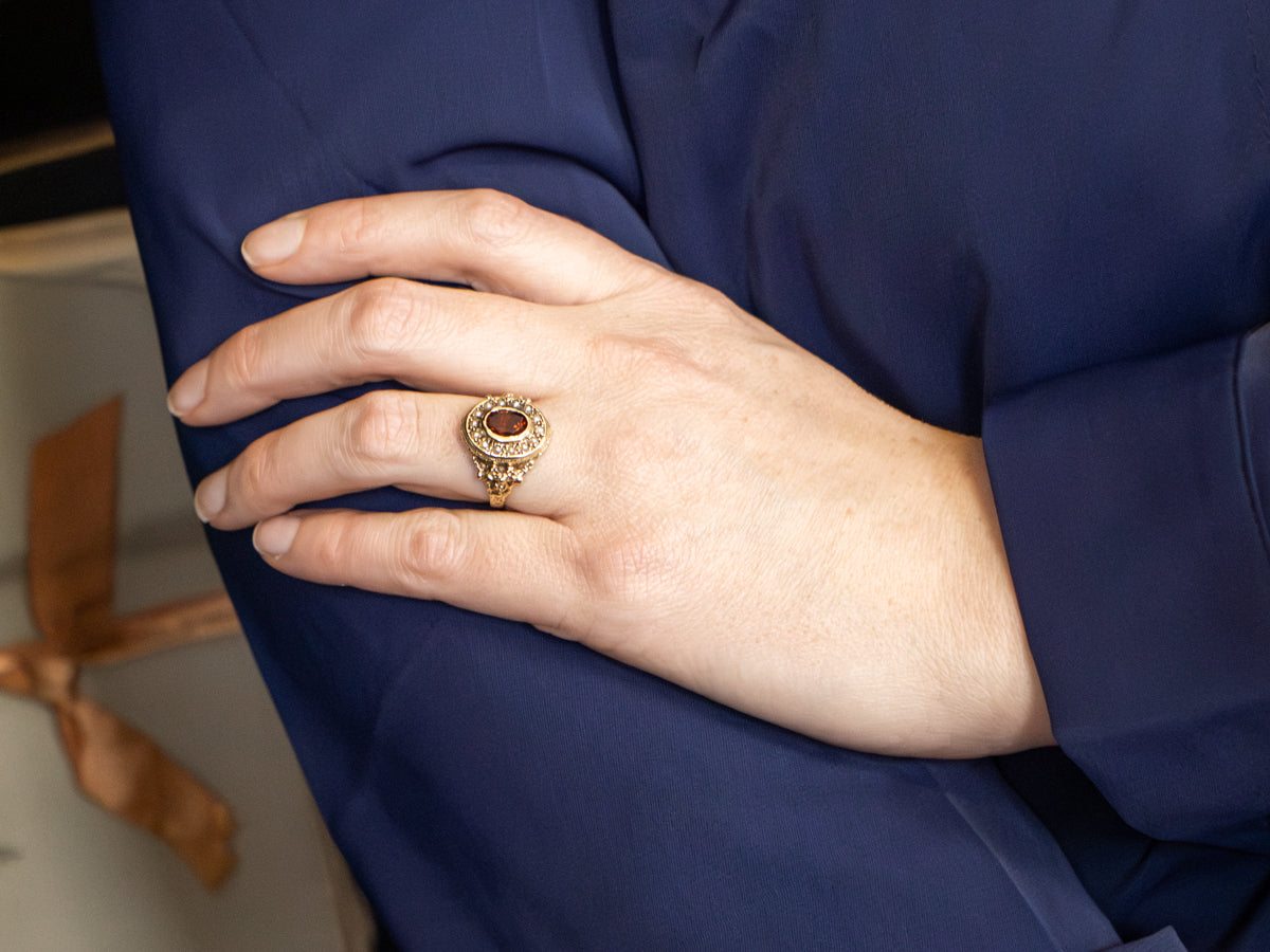 Antique Antique Gold Garnet and Seed Pearl Halo Ring