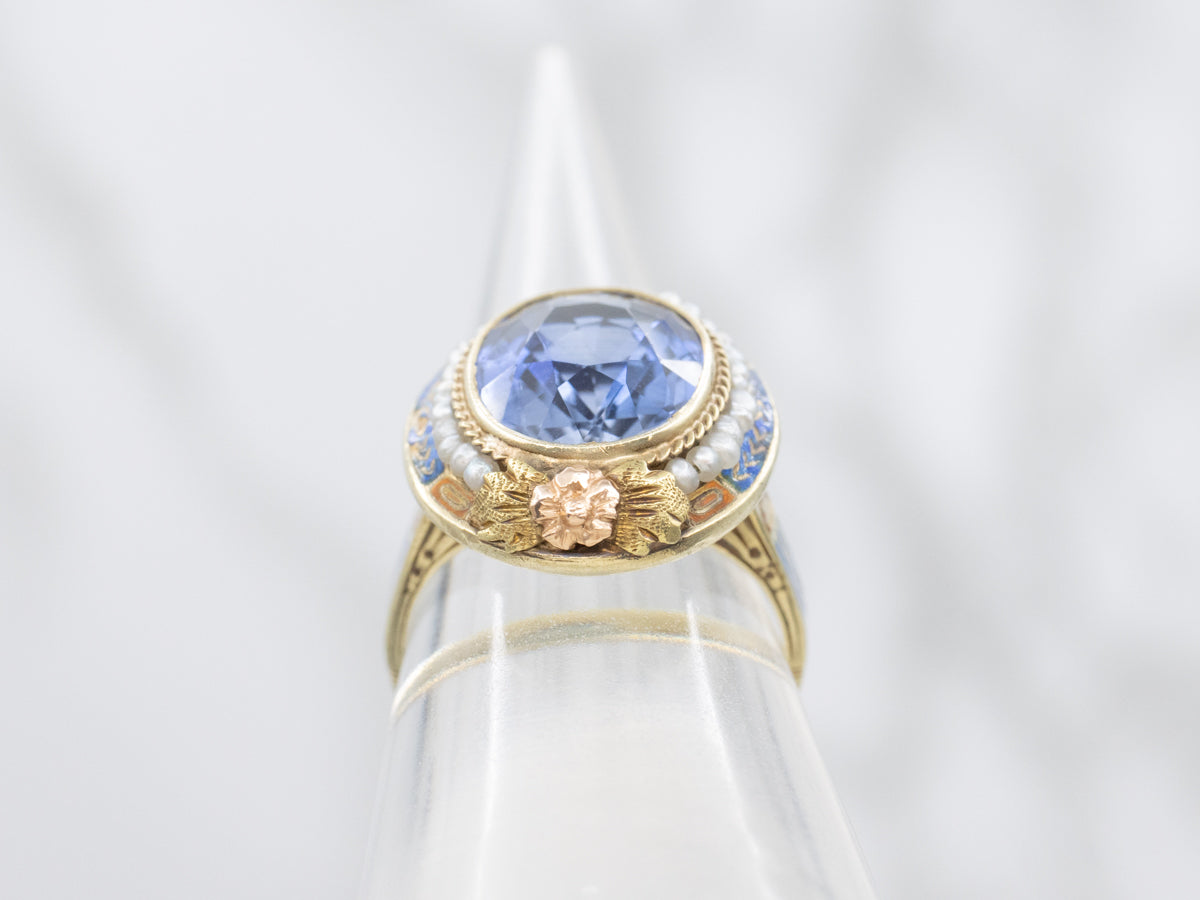 Art Nouveau Era Synthetic Sapphire with Seed Pearl Halo and Blue Enamel Ring