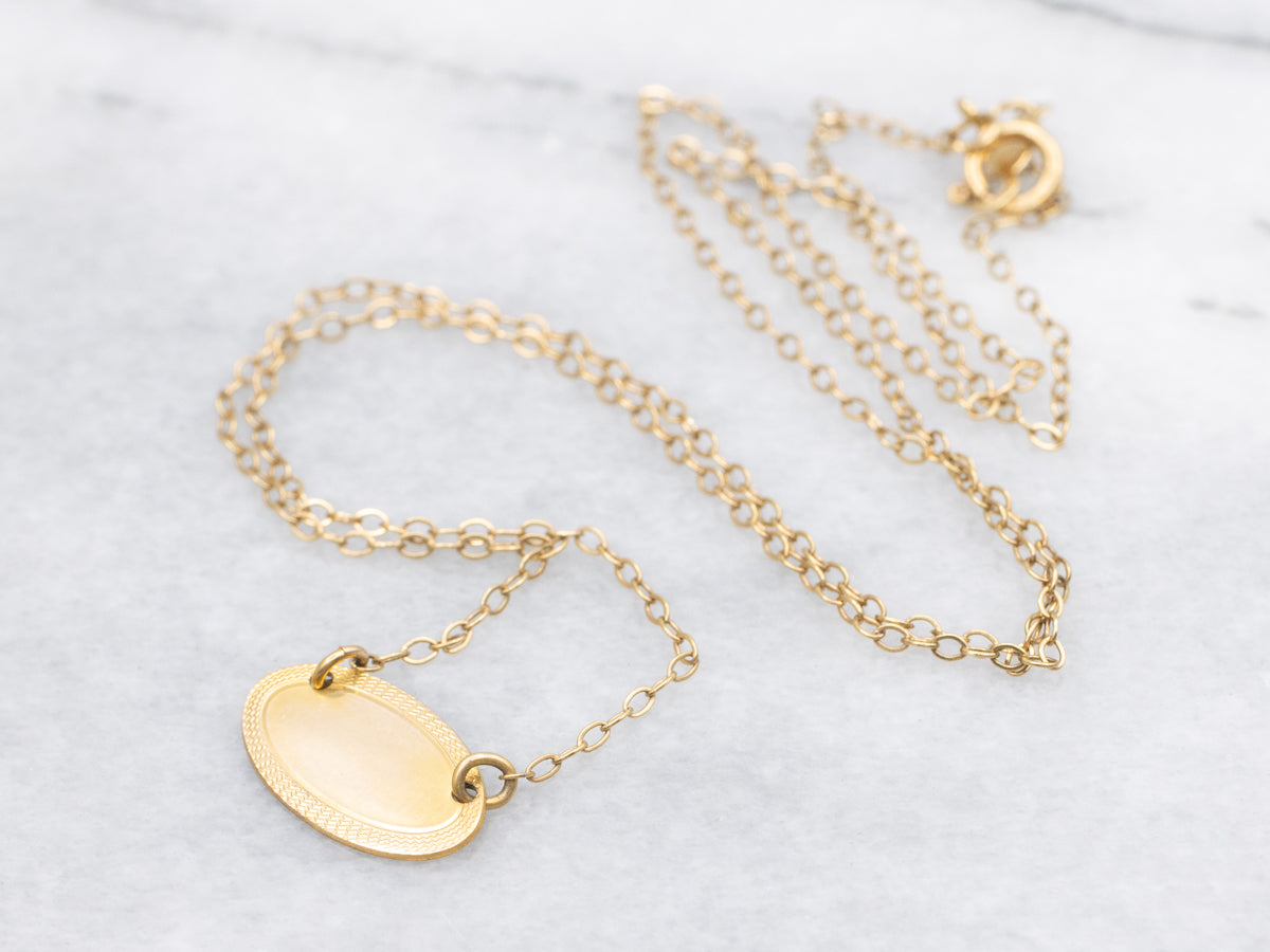 Gold East-to-West Disc Necklace with Engraved Border