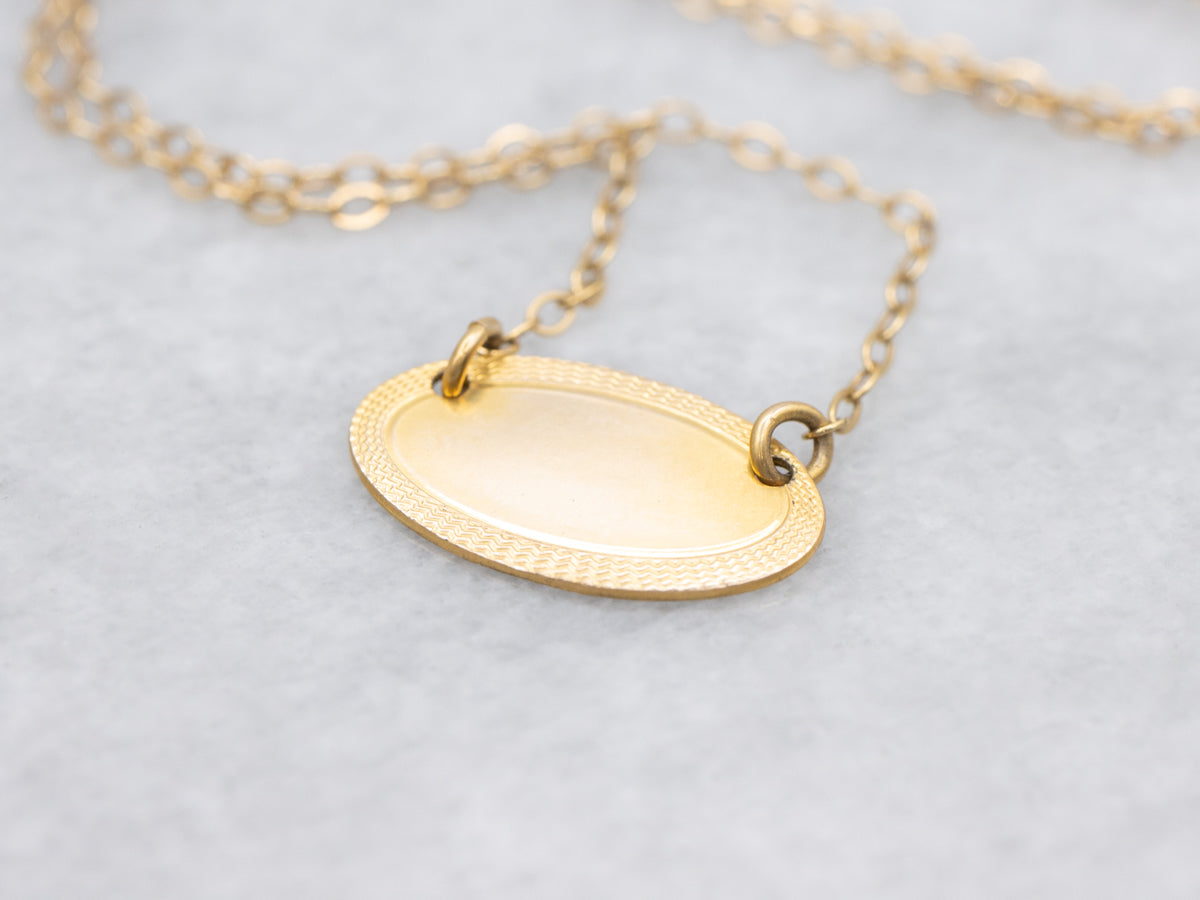 Gold East-to-West Disc Necklace with Engraved Border