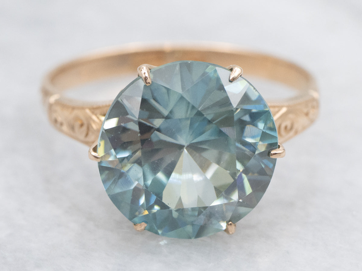 Antique Rose Gold Solitaire Ring with Round Blue Zircon