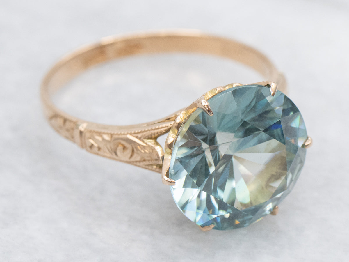 Antique Rose Gold Solitaire Ring with Round Blue Zircon