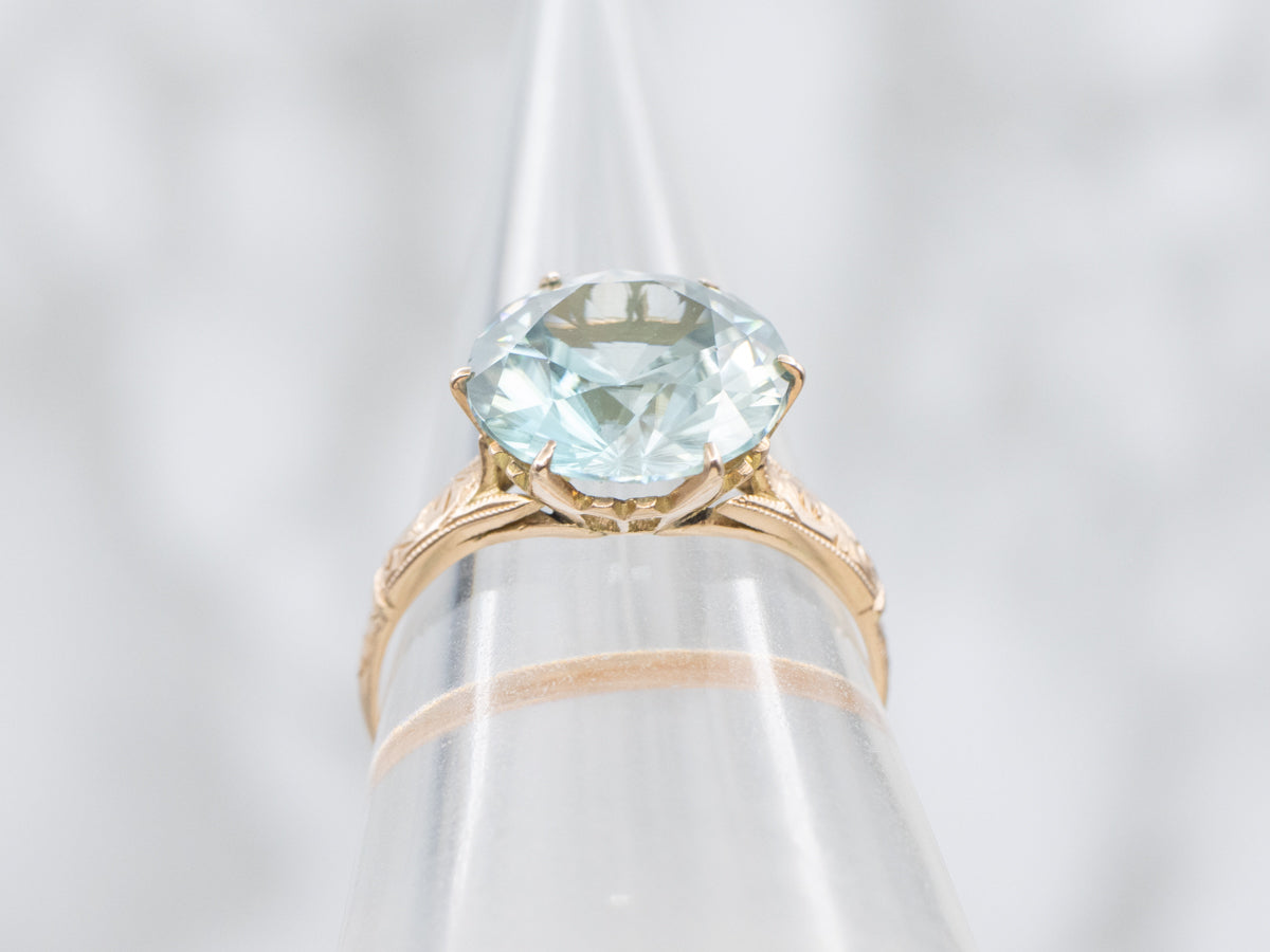 Antique Rose Gold Solitaire Ring with Round Blue Zircon