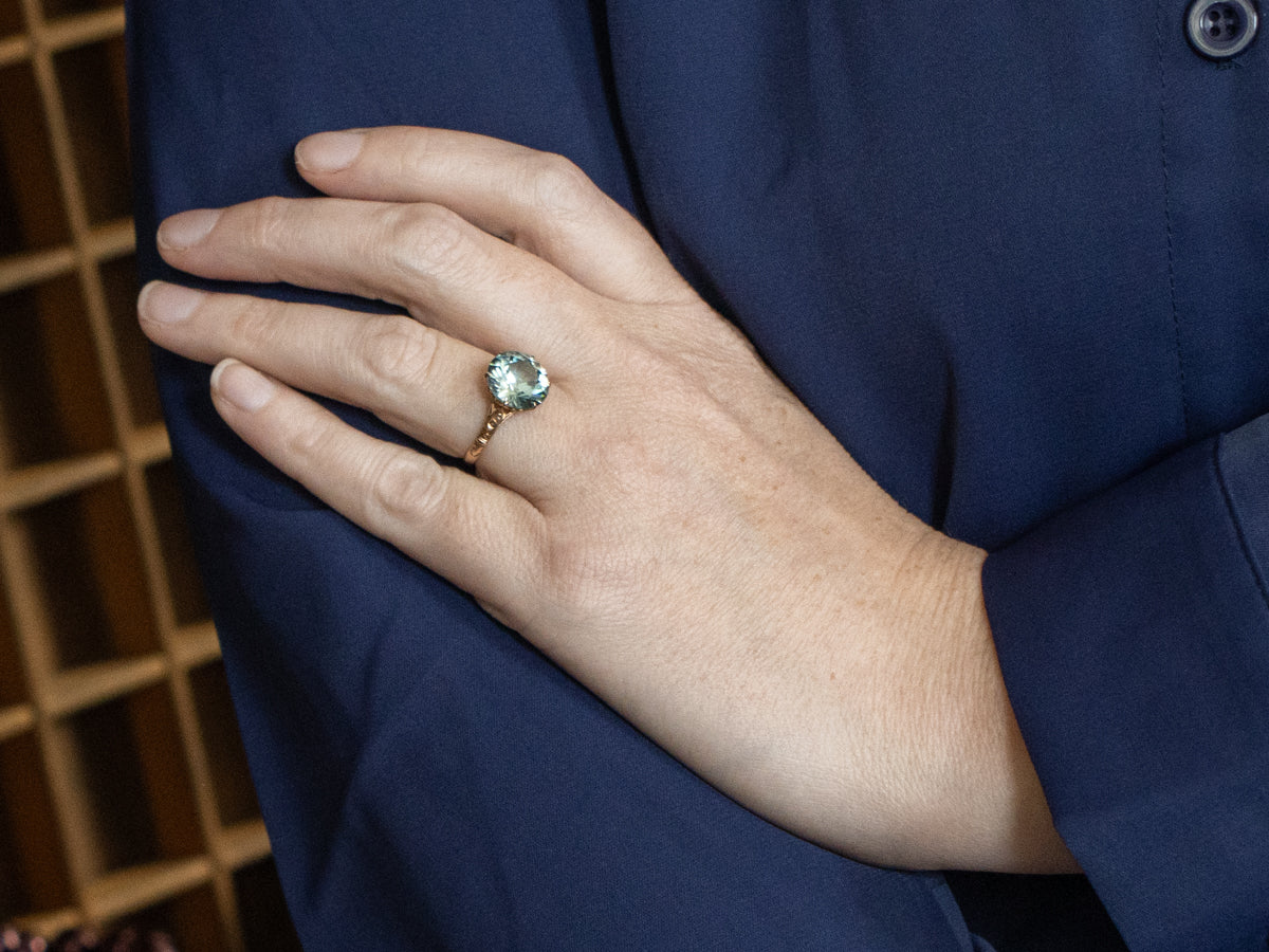 Antique Rose Gold Solitaire Ring with Round Blue Zircon