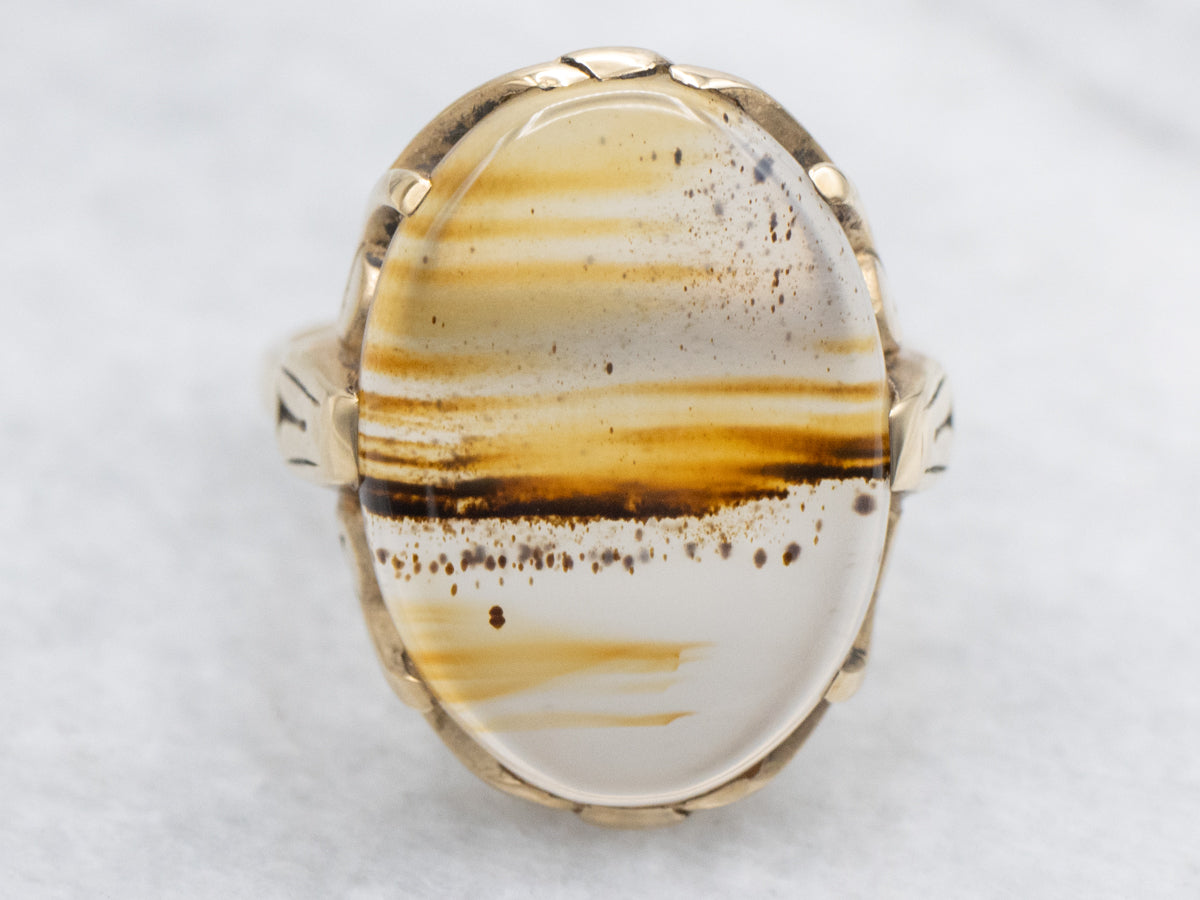 Anillo solitario de oro amarillo con ágata Montana