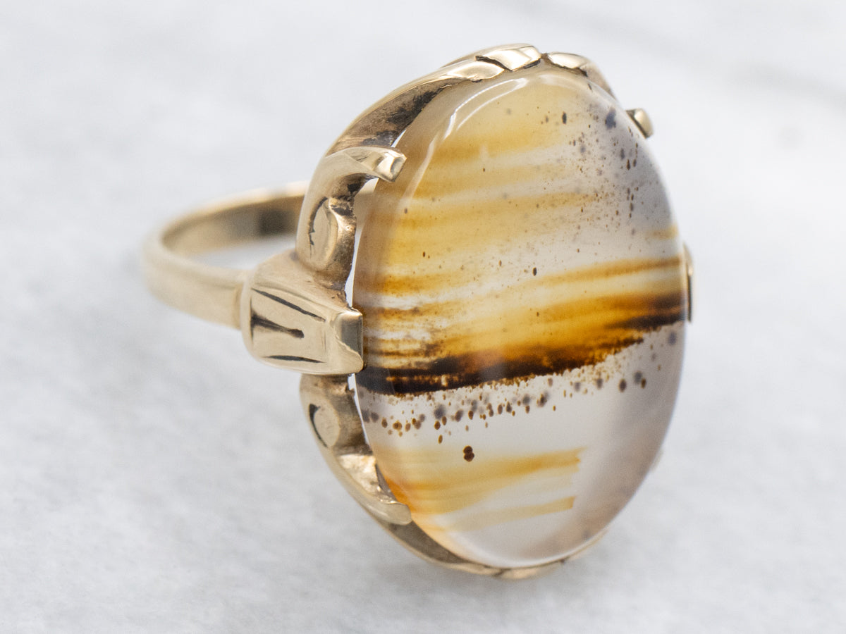 Anillo solitario de oro amarillo con ágata Montana