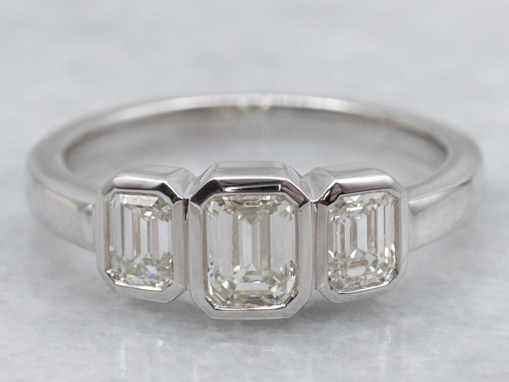 Modern Emerald-Cut Diamond Three Stone Engagement Ring