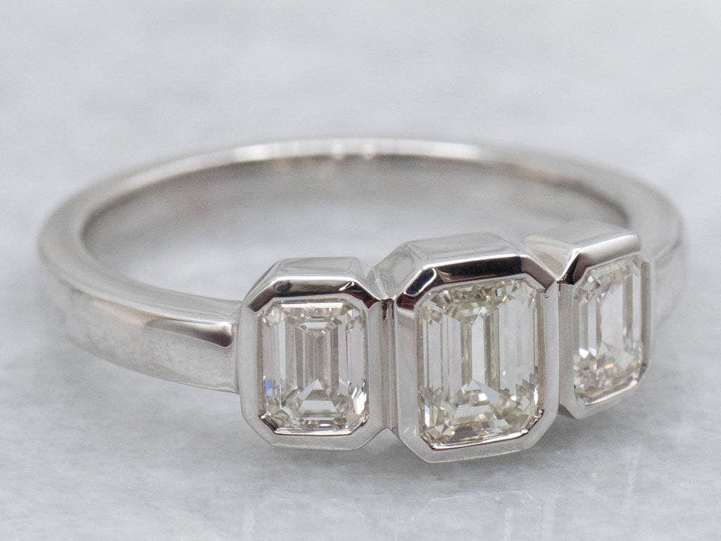 Modern Emerald-Cut Diamond Three Stone Engagement Ring