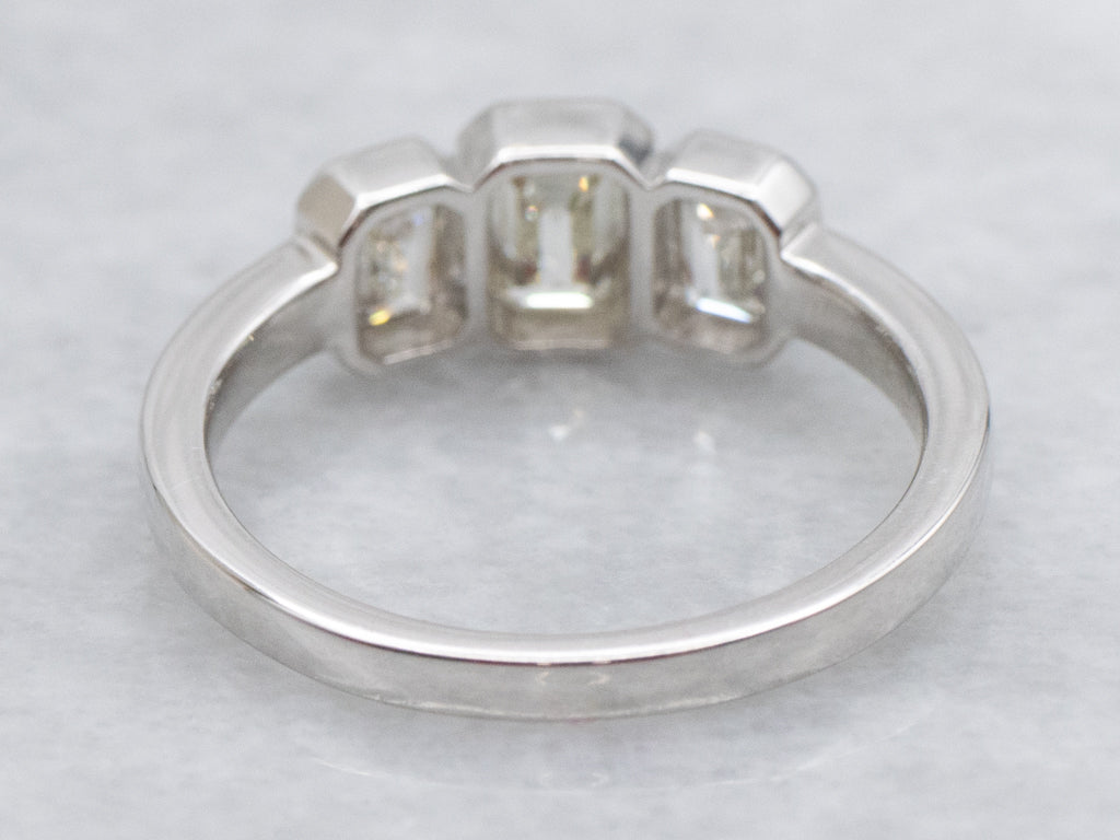 Modern Emerald-Cut Diamond Three Stone Engagement Ring