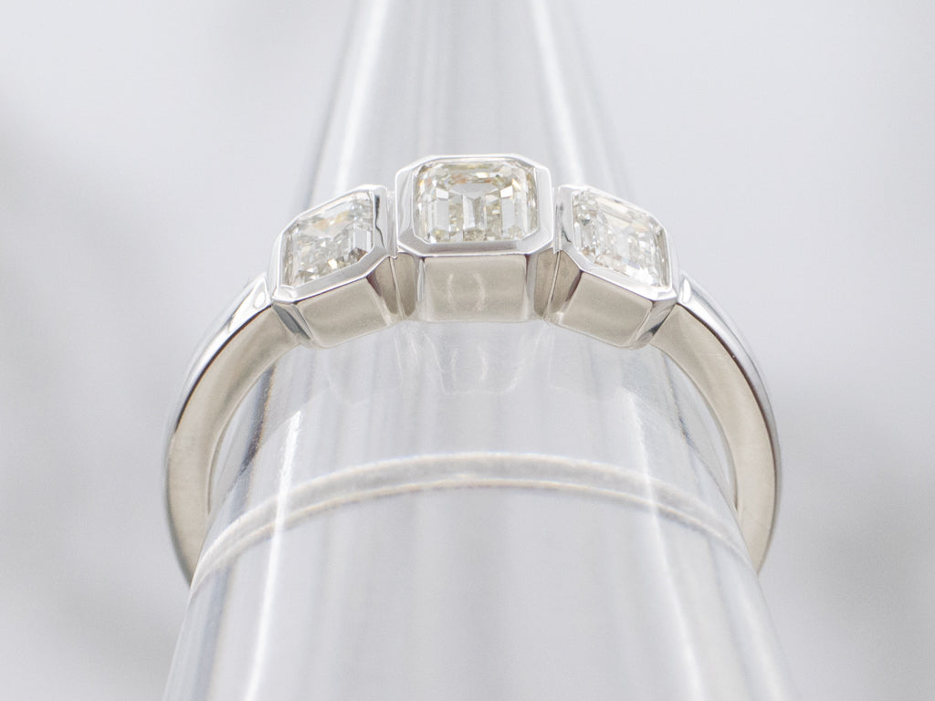 Modern Emerald-Cut Diamond Three Stone Engagement Ring