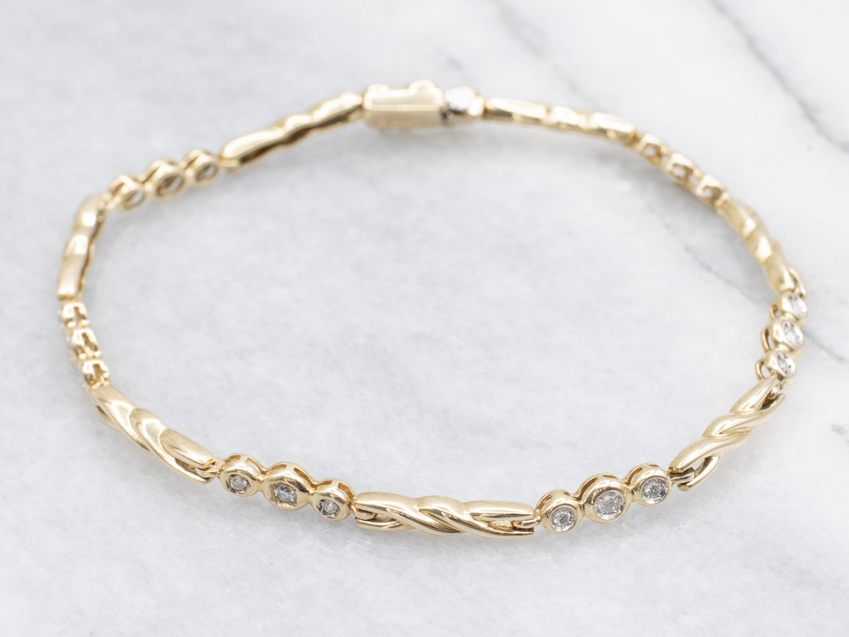Twisting Gold Bezel Set Diamond Link Bracelet