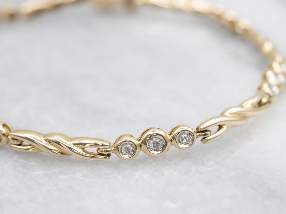 Twisting Gold Bezel Set Diamond Link Bracelet