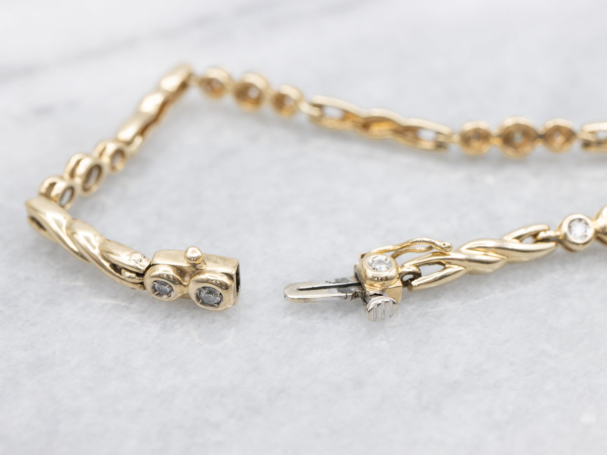 Twisting Gold Bezel Set Diamond Link Bracelet