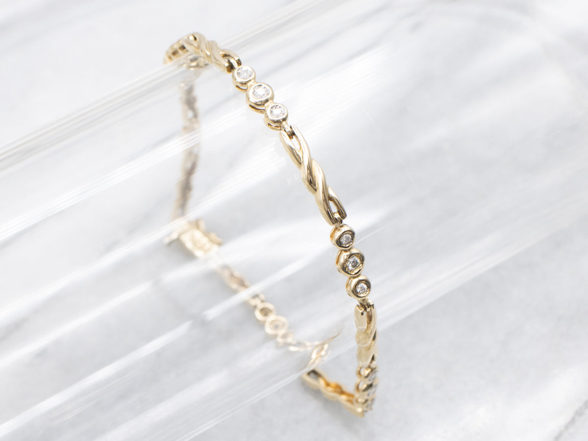 Twisting Gold Bezel Set Diamond Link Bracelet
