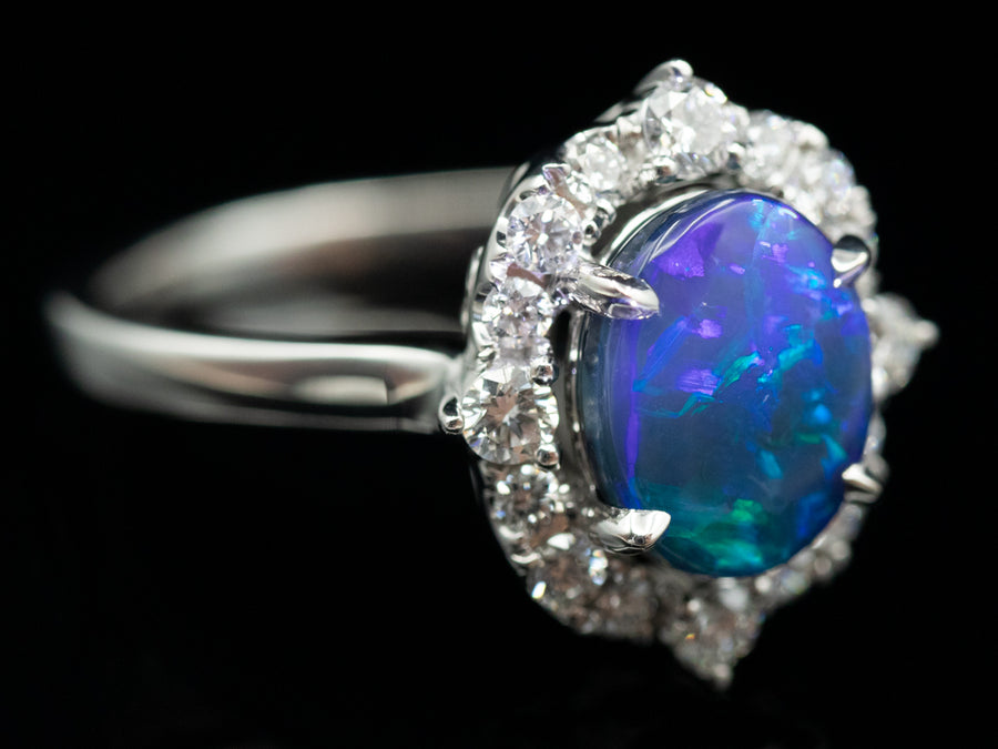 18K White Gold Black Opal Oval and Diamond Halo Ring