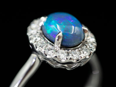 18K White Gold Black Opal Oval and Diamond Halo Ring