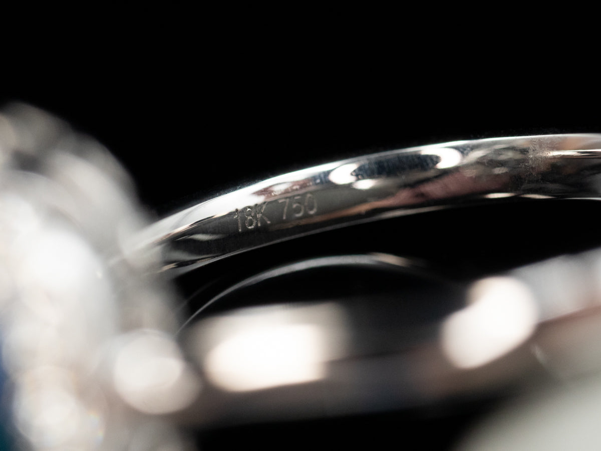 18K White Gold Black Opal Oval and Diamond Halo Ring