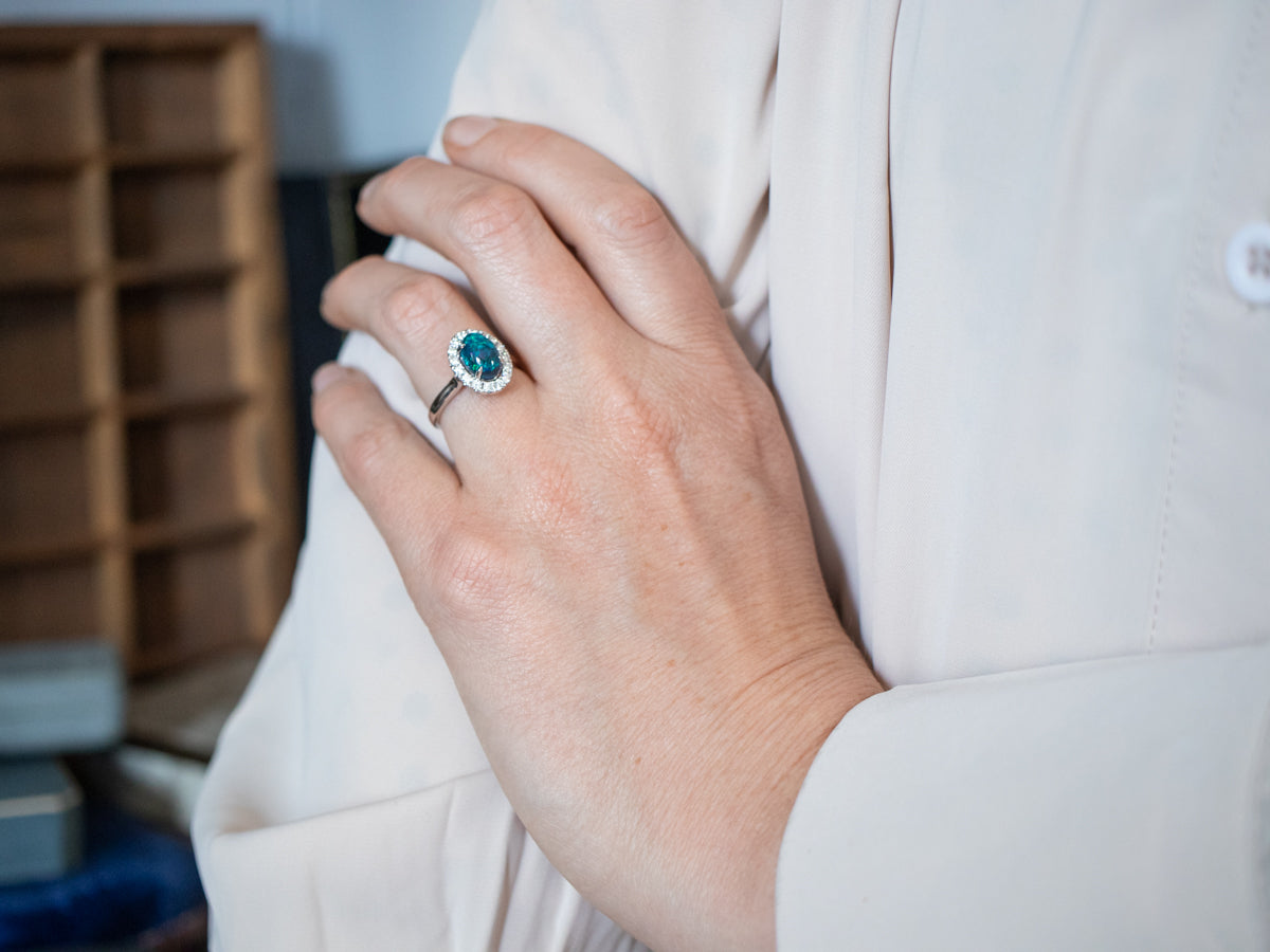 18K White Gold Black Opal Oval and Diamond Halo Ring