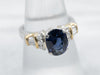 Modern Platinum and 18K Gold Sapphire and Diamond Engagement Ring