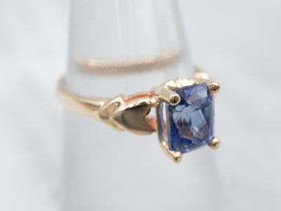 Sophisticated Yellow Gold and Blue Sapphire Solitaire Engagement Ring
