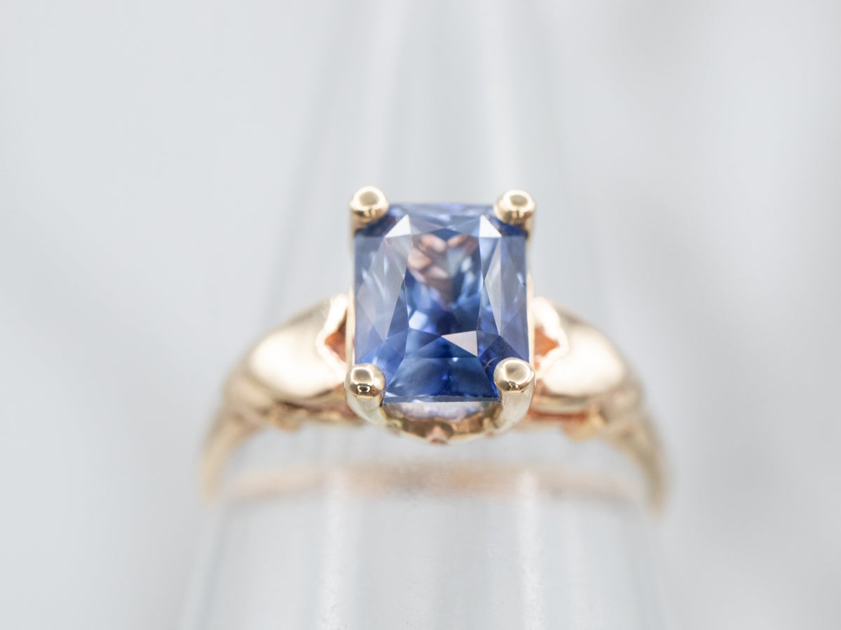 Sophisticated Yellow Gold and Blue Sapphire Solitaire Engagement Ring