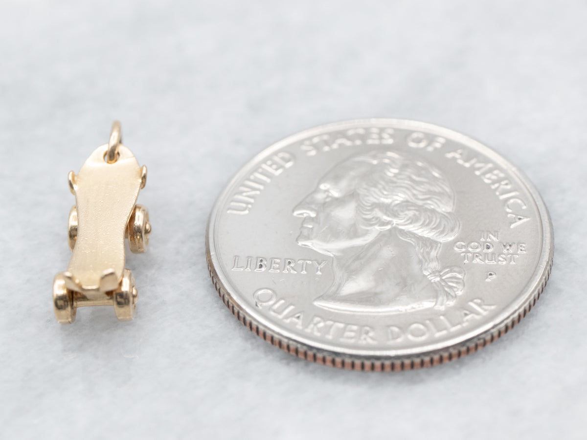 Encanto de patín de ruedas de oro vintage