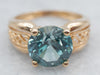 Yellow Gold Blue Zircon Solitaire Ring with Filigree Shoulders