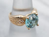 Yellow Gold Blue Zircon Solitaire Ring with Filigree Shoulders