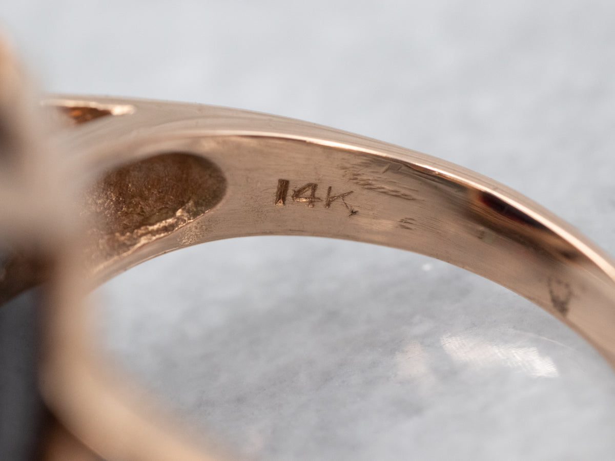 Sleek Rose Gold Garnet Solitaire Cocktail Ring