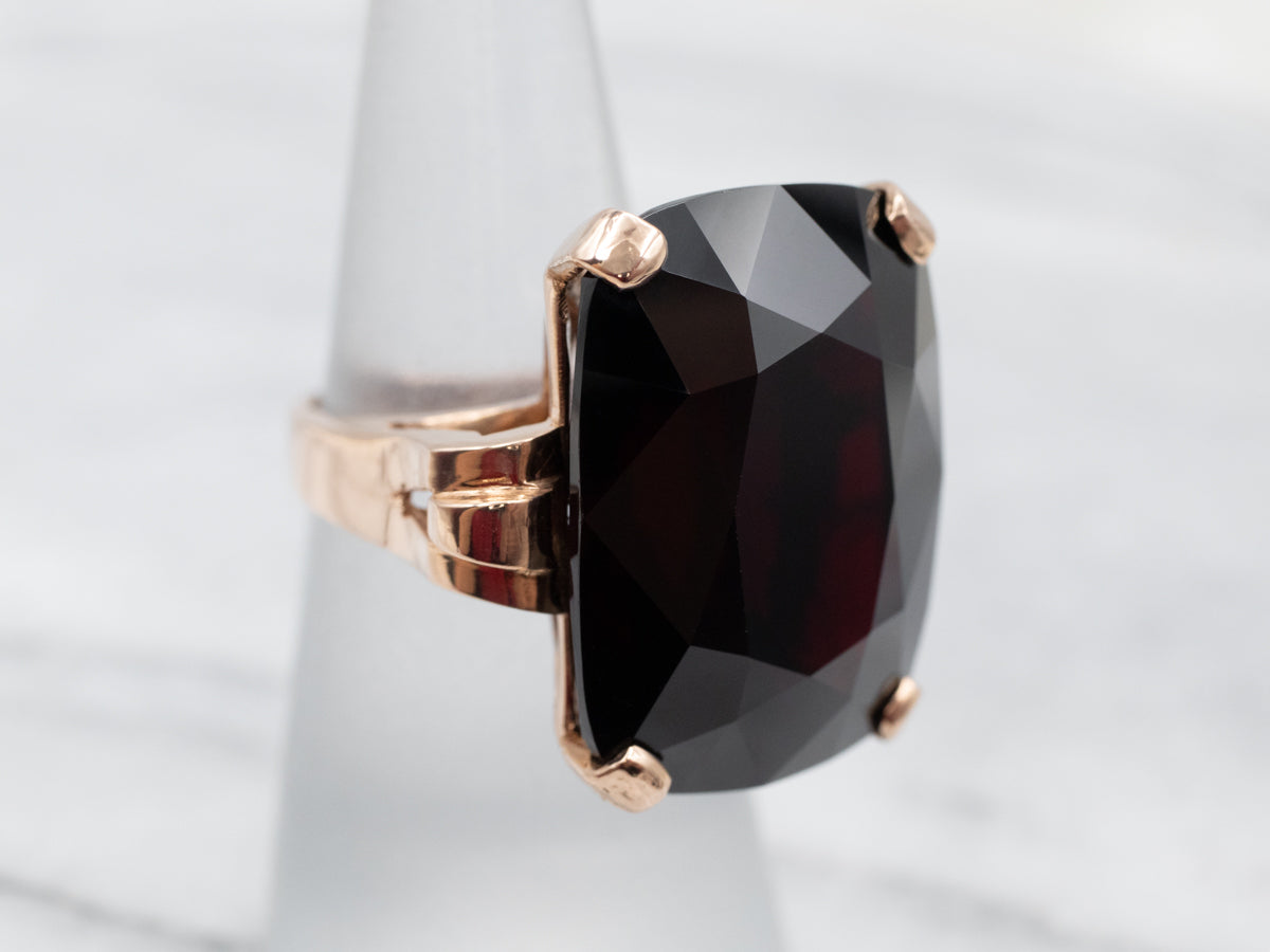 Sleek Rose Gold Garnet Solitaire Cocktail Ring