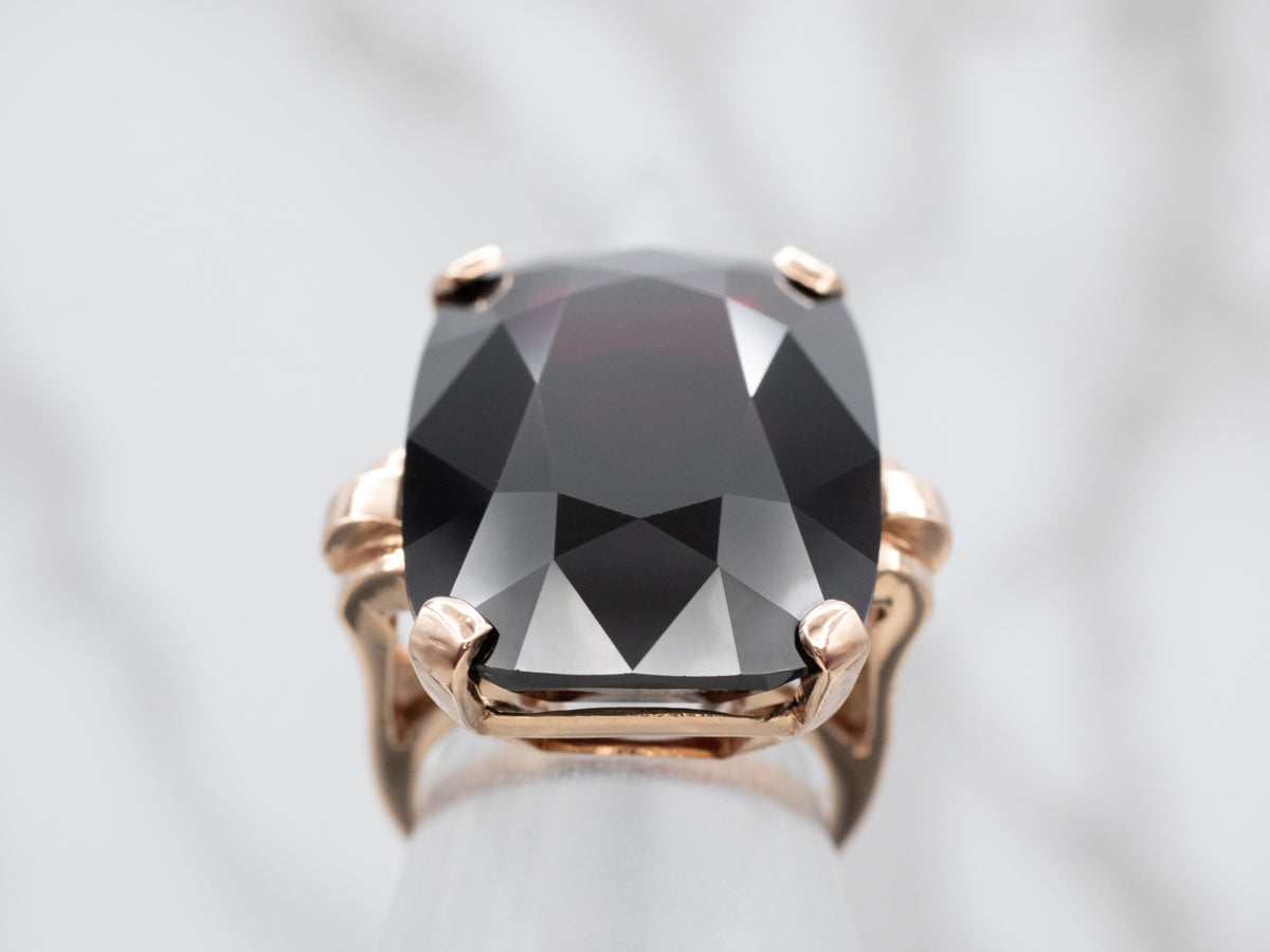 Sleek Rose Gold Garnet Solitaire Cocktail Ring