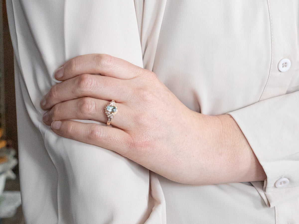 Modern Gold Aquamarine and Diamond Halo Ring