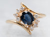 Sleek Yellow Gold Sapphire Bypass Ring with Diamond Accents
