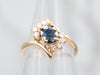 Sleek Yellow Gold Sapphire Bypass Ring with Diamond Accents