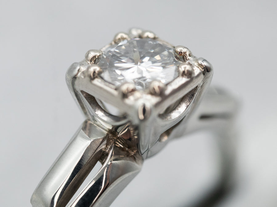Interesting White Gold Diamond Solitaire Engagement Ring