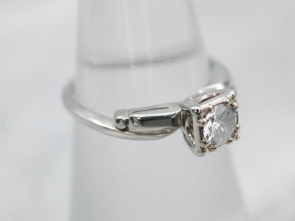 Interesting White Gold Diamond Solitaire Engagement Ring