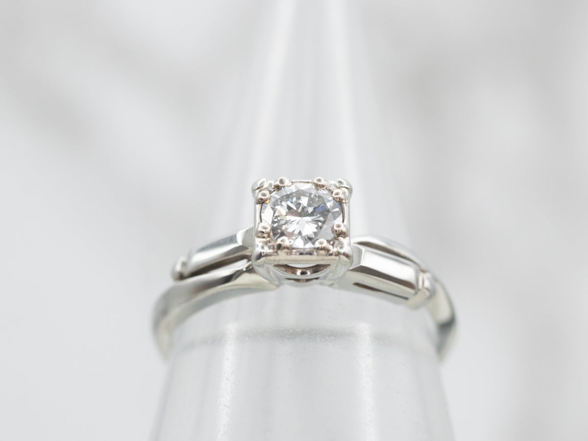 Interesting White Gold Diamond Solitaire Engagement Ring