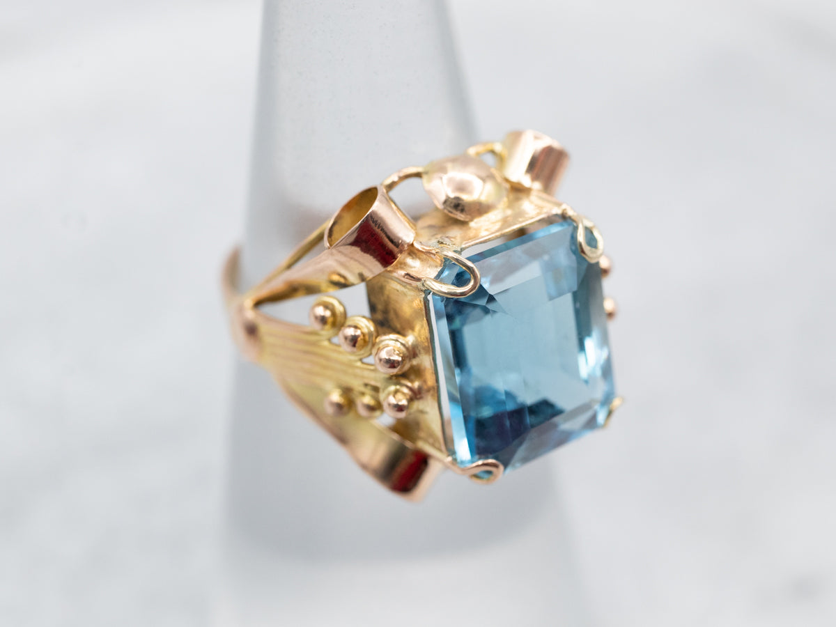 Sparkling Yellow Gold Blue Topaz Solitaire Cocktail Ring