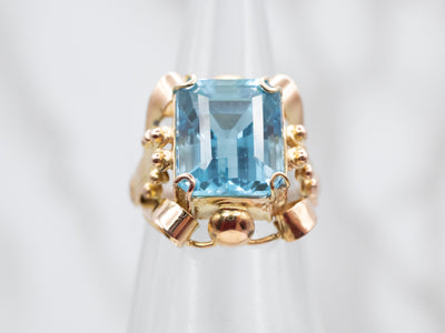 Sparkling Yellow Gold Blue Topaz Solitaire Cocktail Ring