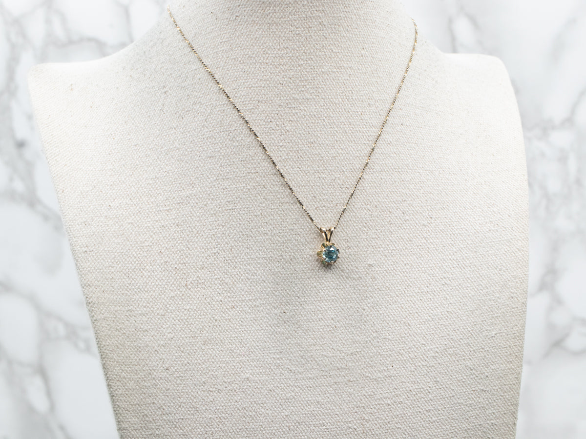 Colgante Solitario Botón de Oro Amarillo con Circonitas Azules