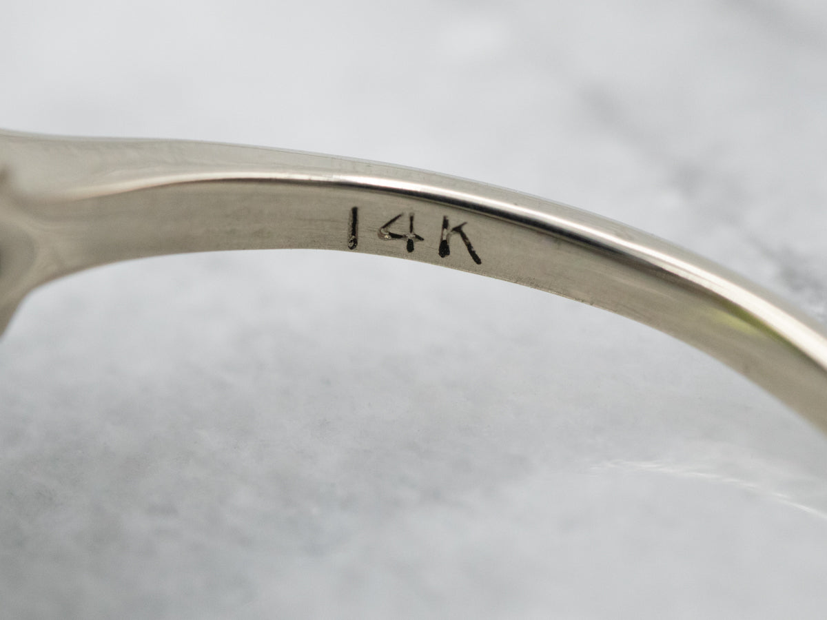 Sophisticated White Gold Peridot Cocktail Ring with Diamond Accents