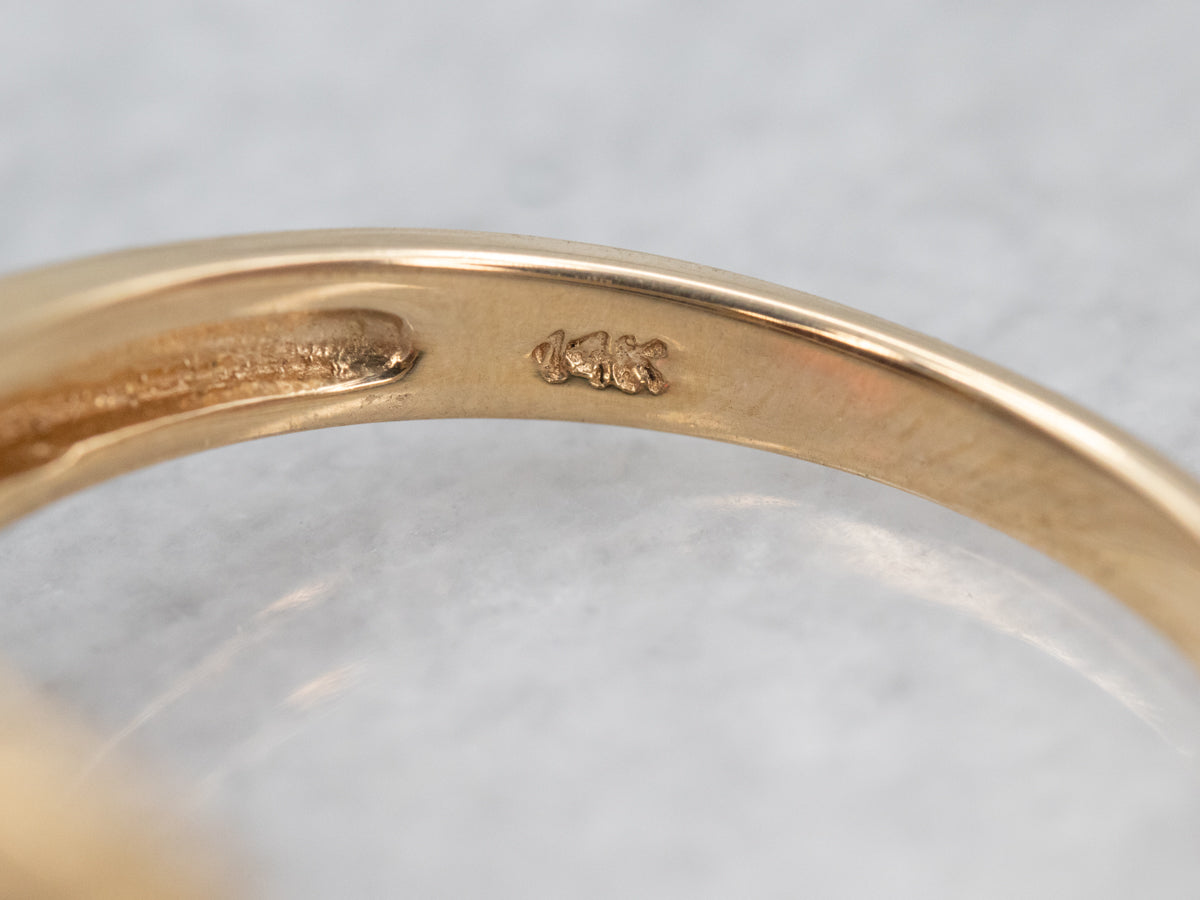 Rich Yellow Gold Garnet Cocktail Ring with Baguette Diamond Accents