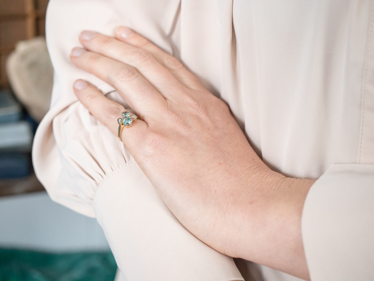 Lovely Gold Blue Zircon Bypass Ring with Diamond Accents