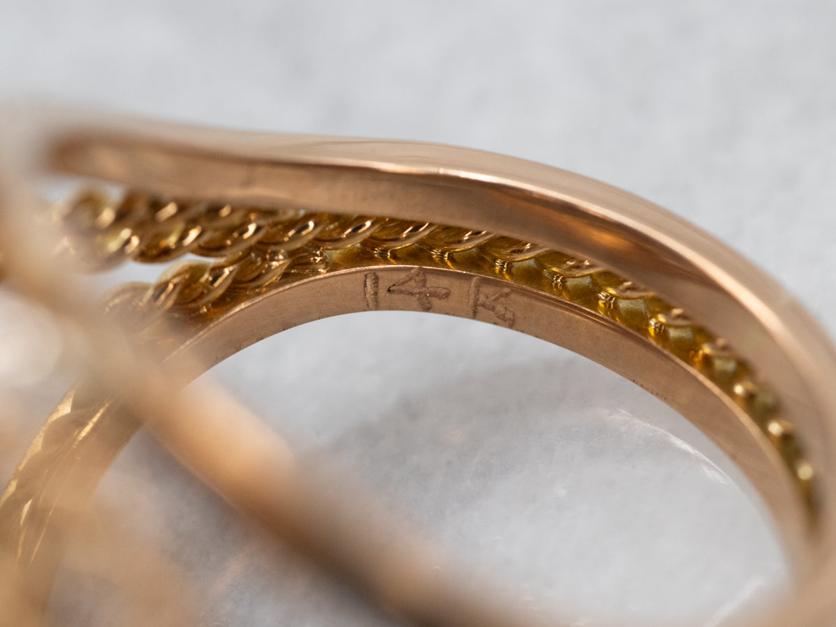 Elegant Two Tone East West Garnet Cocktail Ring with Diamond Accents